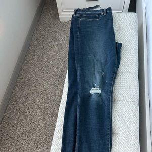 Levi’s Curvy Skinny Jeans with frayed hem and distressing on legs